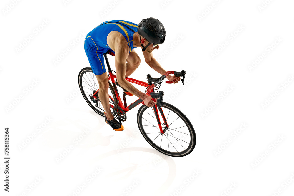Fototapeta premium Top view image of man, athlete in uniform, helmet and goggles riding bicycle isolated on white studio background. Concept of sport, active and healthy lifestyle, speed, endurance, hobby