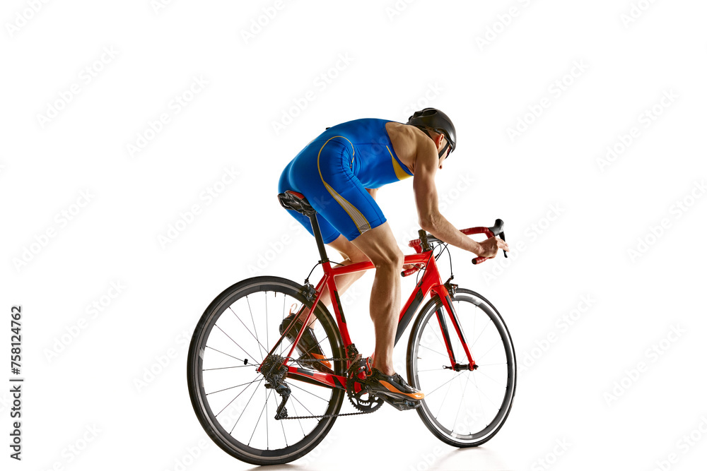 Side view image of concentrated sportsman in blue sportswear and helmet in motion on bike isolated on white studio background. Concept of sport, active and healthy lifestyle, speed, endurance, hobby Side view image of concentrated sportsman in blue sportswear and helmet in motion on bike isolated on white studio background. Concept of sport, active and healthy lifestyle, speed, endurance, hobby