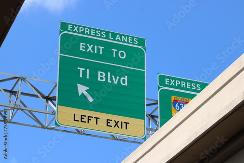 Express Lanes Exit Sign mark the direction westward. The current construction of multi-lanes, re-dos, new ramps of the eastern corridor of I-635 will not complete for a year.