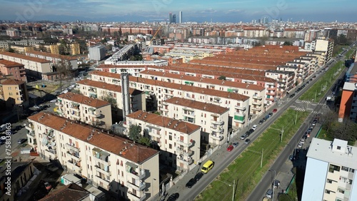 Italy, Milan 03-14-2024 Aler public housing blocks to be demolished in the suburban neighborhood of Giambellino Lorenteggio - Drone view of occupied poor homes - urban redevelopment of the suburbs photo