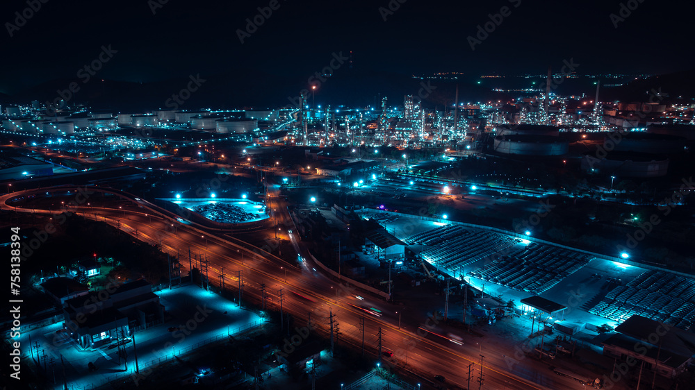 Aerial view night scene, traffic light, city and industrial plant, oil refinery, blue tone,