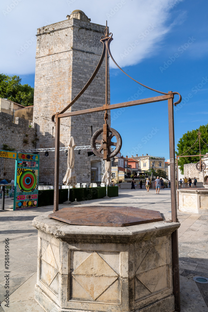 Square of the five wells
Trg pet bunara, Captain's tower
Kapetanova kula, Church tower of San Simeon
Crkva sv. Simoom, in the old historic center of the city Zadar Croatia. Square of the five wells
Trg pet bunara, Captain's tower
Kapetanova kula, Church tower of San Simeon
Crkva sv. Simoom, in the old historic center of the city Zadar Croatia.