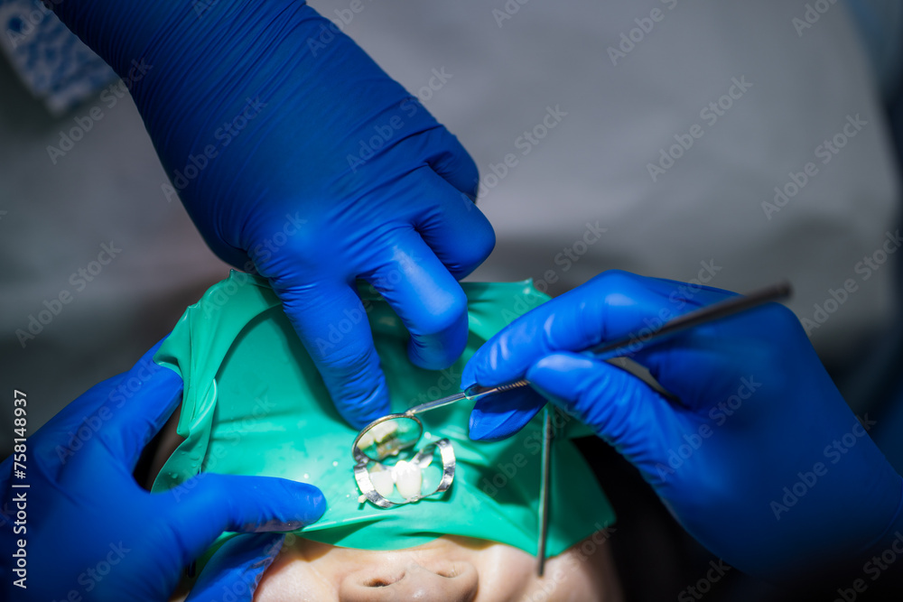 A closeup view captures the intricate work of a dental procedure
