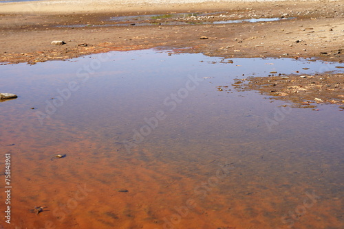 Water ponds developed on the beach during the low water tide season. 