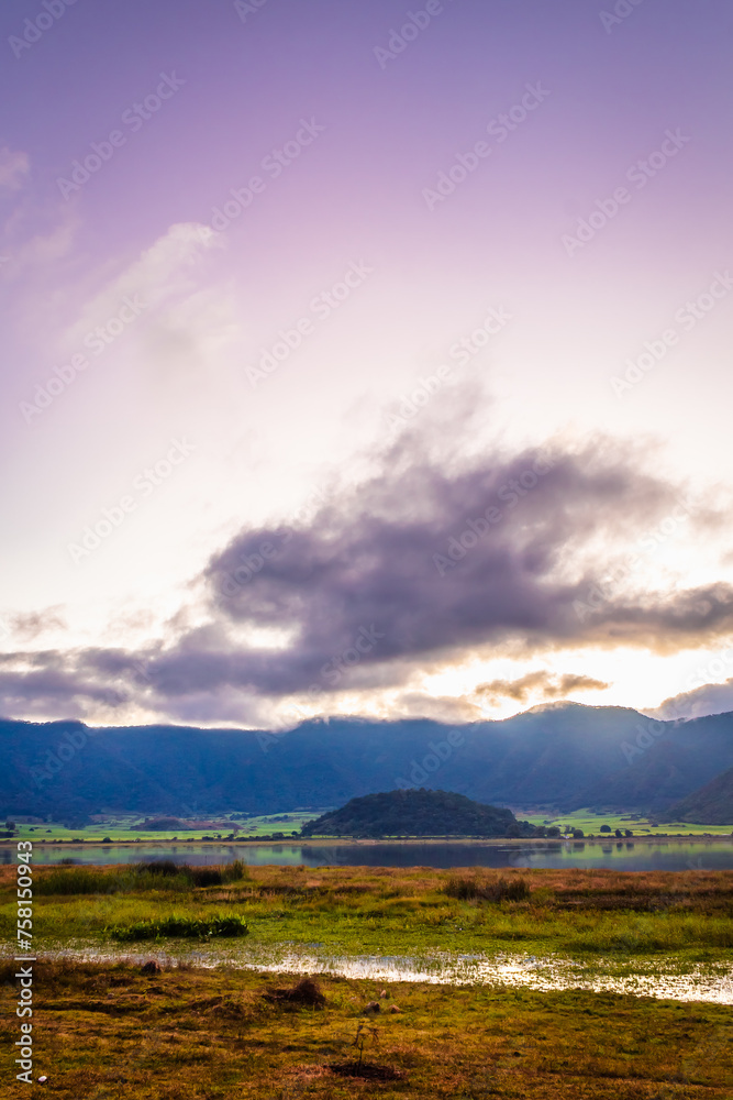 Obraz premium Volcanic landscape with lake at sunset in the crater of the Tepetiltic volcano in Nayarit