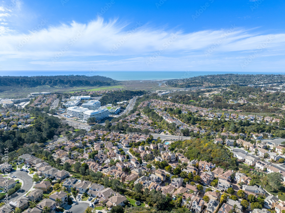 Aerial view of middle class subdivision neighborhood with residential condos and houses in San Diego, California, USA.
