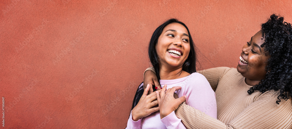 © Alessandro Biascioli - Portrait of happy Latin girls having fun embracing outdoor - Young people lifestyle and friendship concept
