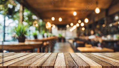 empty wooden table in front of abstract blurred background for product display in a coffee shop local market or bar