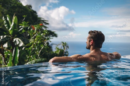 Handsome man taking a refreshing dip in a private Caribbean villa's infinity pool, his athletic physique glistening with water droplets in the tropical sunshine