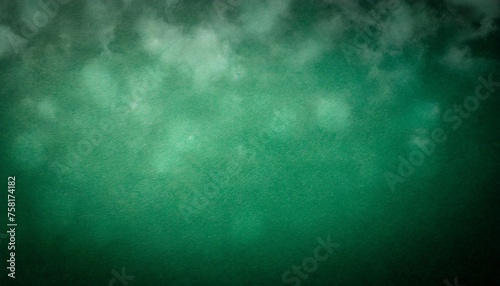 dark green background texture with black vignette in old vintage cloudy textured design christmas or st patrick s day paper