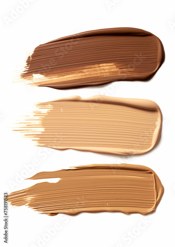 Set of three smears of foundation texture in different colors of dark, medium and light skin colors isolated on white background, BB CC foundation smudged cream white isolated background.