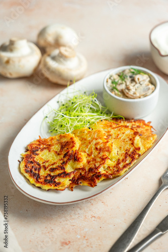 Potato pancakes Deruny with mushroom sauce