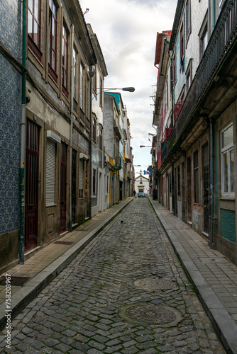 narrow street in the old town of Porto Portugal © AGORA Images