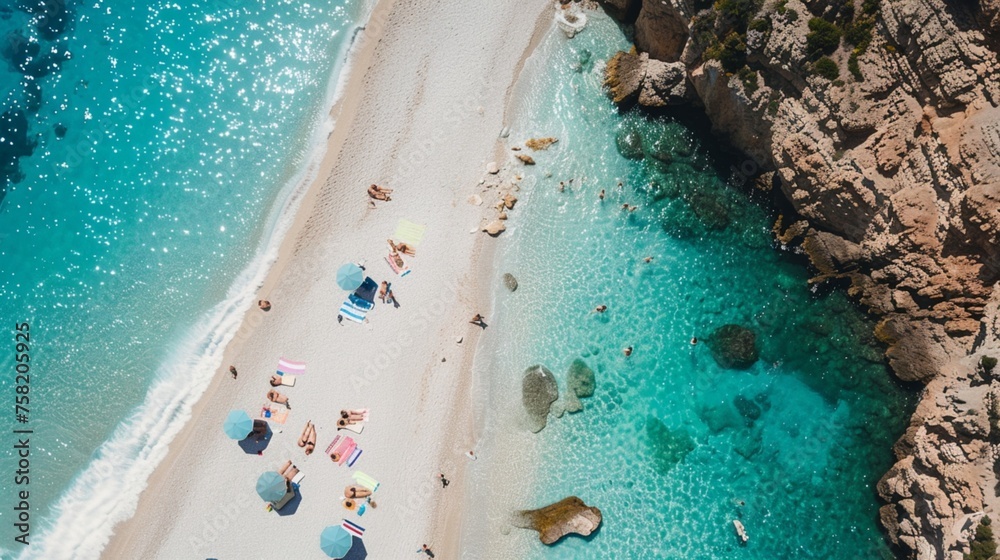 Aerial photo of a beach with turquoise water and white sand with umbrellas, people sunbathing, swimming and enjoying leisure. Vacation and travel concept
