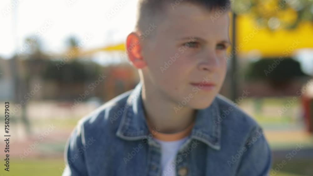 Teenager sits outdoors, exuding tranquility, while contemplating surroundings. Teenager sits outdoors, exuding tranquility, while contemplating surroundings.