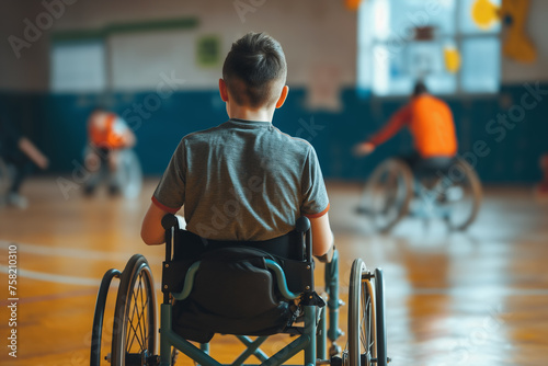 Rear view of high school male person, wheelchair user, while sports activity on sports court in school. photo