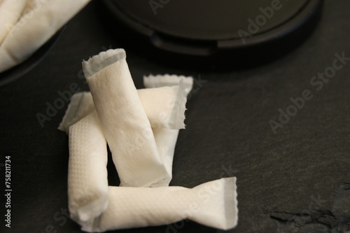 White nicotine pouches with black packaging. High quality photo