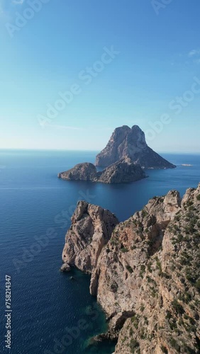 The island of Es Vedra and Pirates Tower. Vertical video. photo