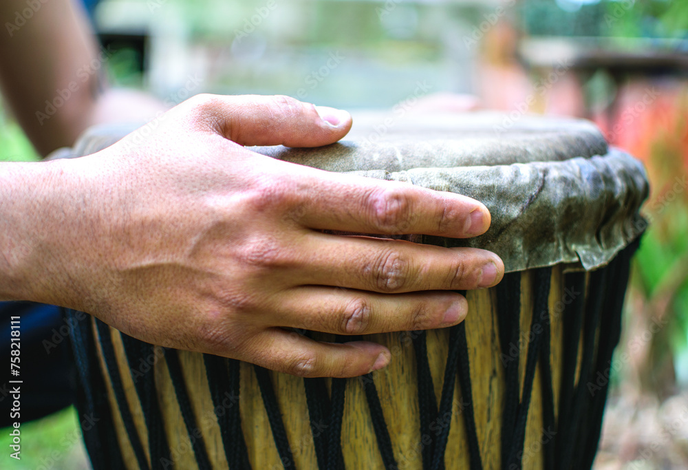Fototapeta premium Drummer hands playing the ethnic djembe drum.