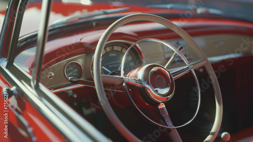 Vintage car interior with a focus on a glossy red steering wheel. © VK Studio