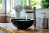 modern bathroom, black ceramic sink and chrome faucet on a wooden counter
