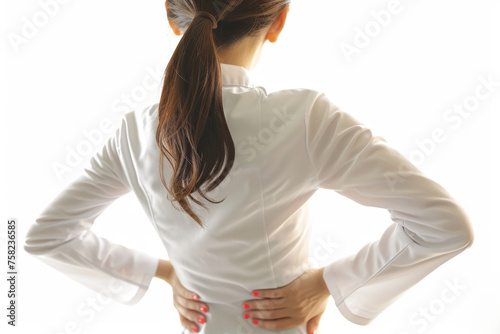 Back pain, a woman has a painful muscle injury in her lower back.
