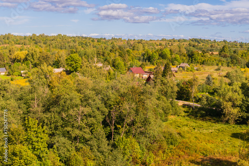 Izborsk, Russia, September 7, 2023. View of a village among the autumn forest. photo