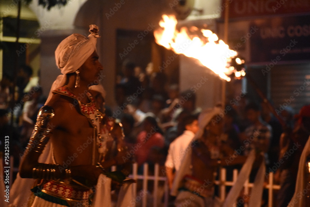 Flames of a coppara torch that lighting in Kandy Esala Perahera at Temple of the Tooth (Sri Dalada Maligawa), Kandy, Sri Lanka. - obrazy, fototapety, plakaty 