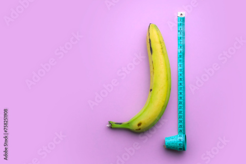 Banana with measuring tape on pink background. Men penis size concept. Flat lay, top view, copy space. photo