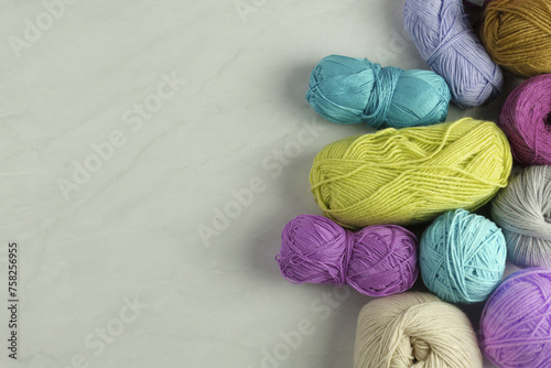 Colorful yarn balls on light background                