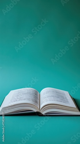 Open book on a green background. Back to school. Copy space.