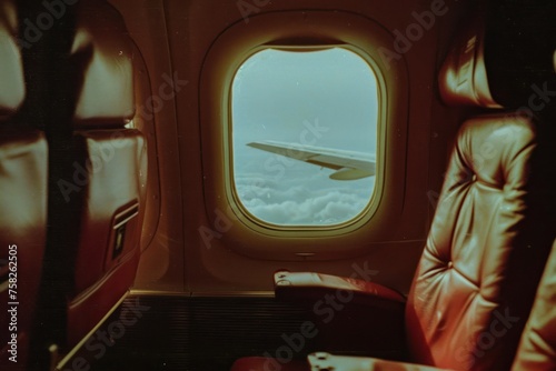 Airplane window view from inside the plane, vintage color tone. © Christiankhs