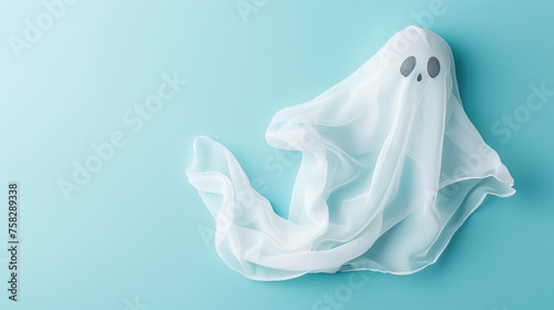 White Halloween ghost with black scary eyes . on pastel blue background