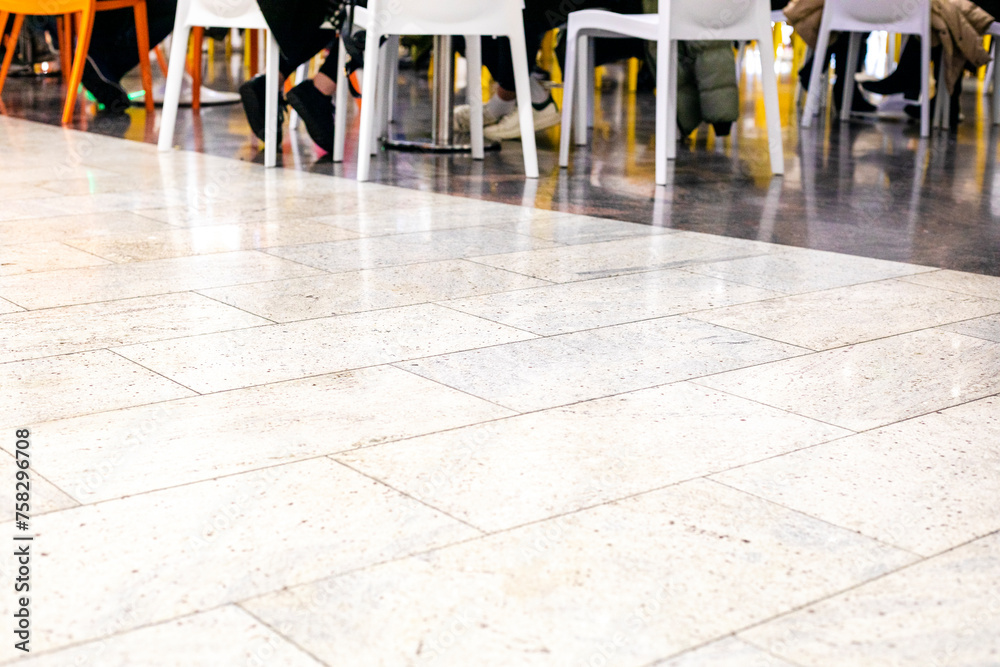 glossy marble flooring in a supermarket tables and chairs in a cafe glossy marble flooring in a supermarket tables and chairs in a cafe