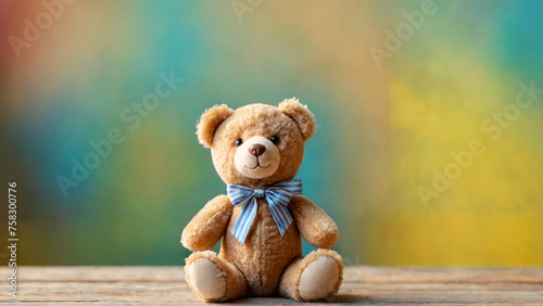 A cute teddy bear is an isolated and colorful studio background.  © Юлия Савельева