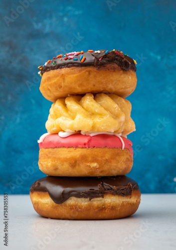 Stack of donuts against blue background