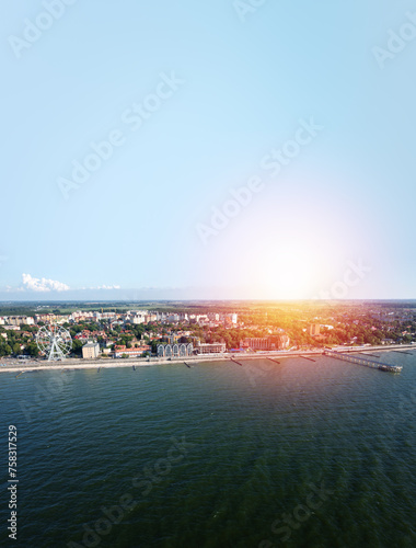 Baltic sea beach with Zelenogradsk embankment. Kaliningrad region. Aerial view. Suset time