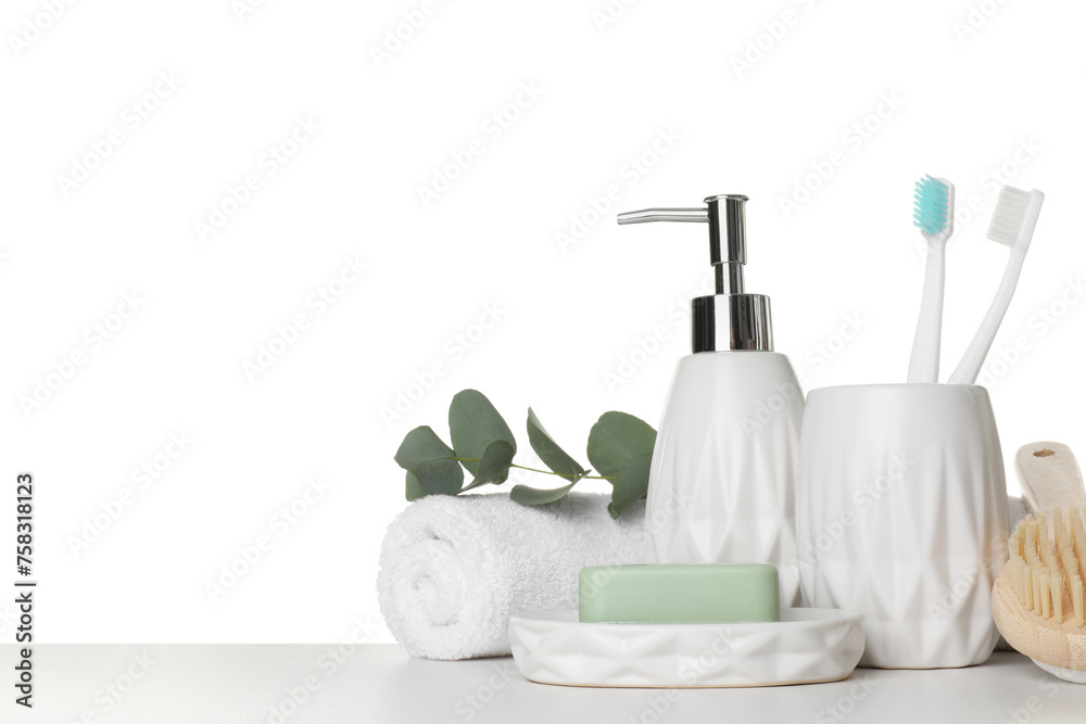 Bath accessories. Different personal care products and eucalyptus branch on table against white background. Space for text