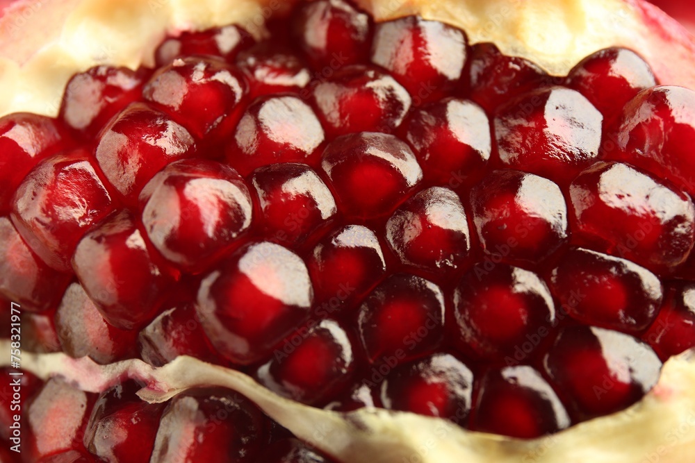 Ripe juicy pomegranate grains as background, closeup