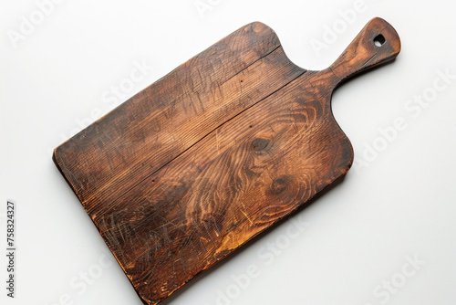 A wooden cutting board placed on a table. Suitable for kitchen or cooking concepts
