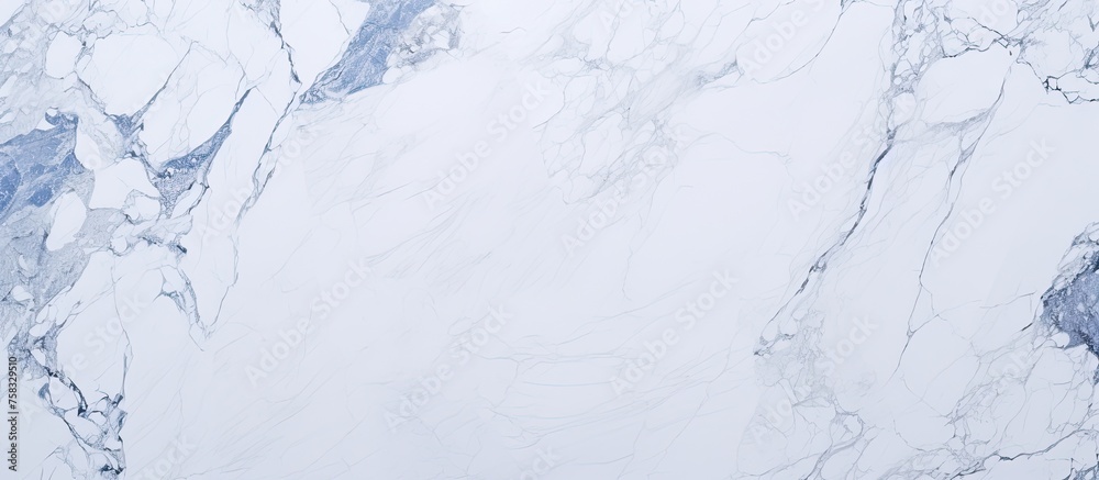 Obraz premium A close up of a white marble texture resembling snowcovered slopes with blue veins, creating an icy cap effect, reminiscent of freezing winter events