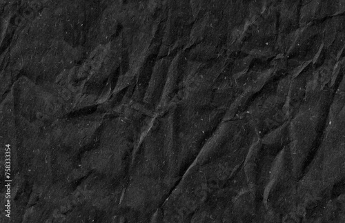 Seamless battered black kraft paper texture. Grunge rough natural page.