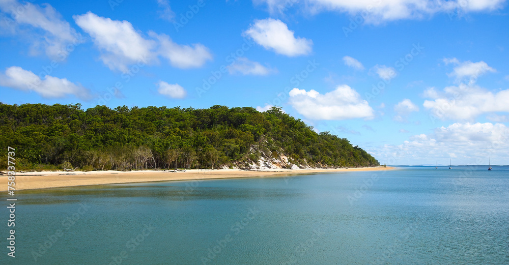 Beach of Kingfisher Bay on the west coast of K'gari (Fraser Island) in Queensland, Australia - Sandy shore at low tide in the Great Sandy Strait