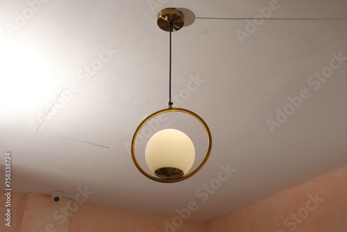 Beautiful light hang on white ceilingr Lights as ornament for decoration. photo