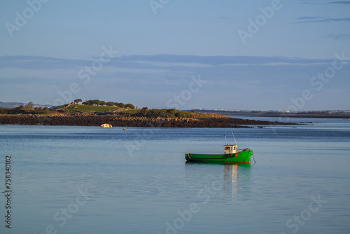 Beautiful scenery with the fishing boat at Mulranny bay in Co. Mayo, Ireland