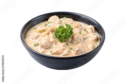 Creamy chicken in a black bowl isolated on transparent background.