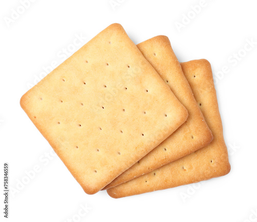 Three crispy crackers isolated on white, top view. Delicious snack