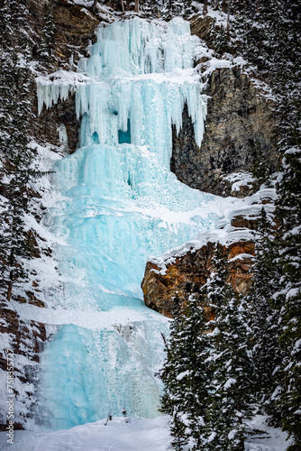 Frozen waterfall at the end of Lake Louise Canadian Winter Landscape