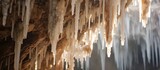 Soda straws, stalagmites, and stalactites are formations made of speleothems, a natural material found in caves. The icicles hanging from the ceiling are a result of a freezing event