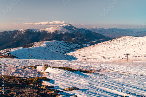Snow covered slopes of Sierra de Guadarrama photo